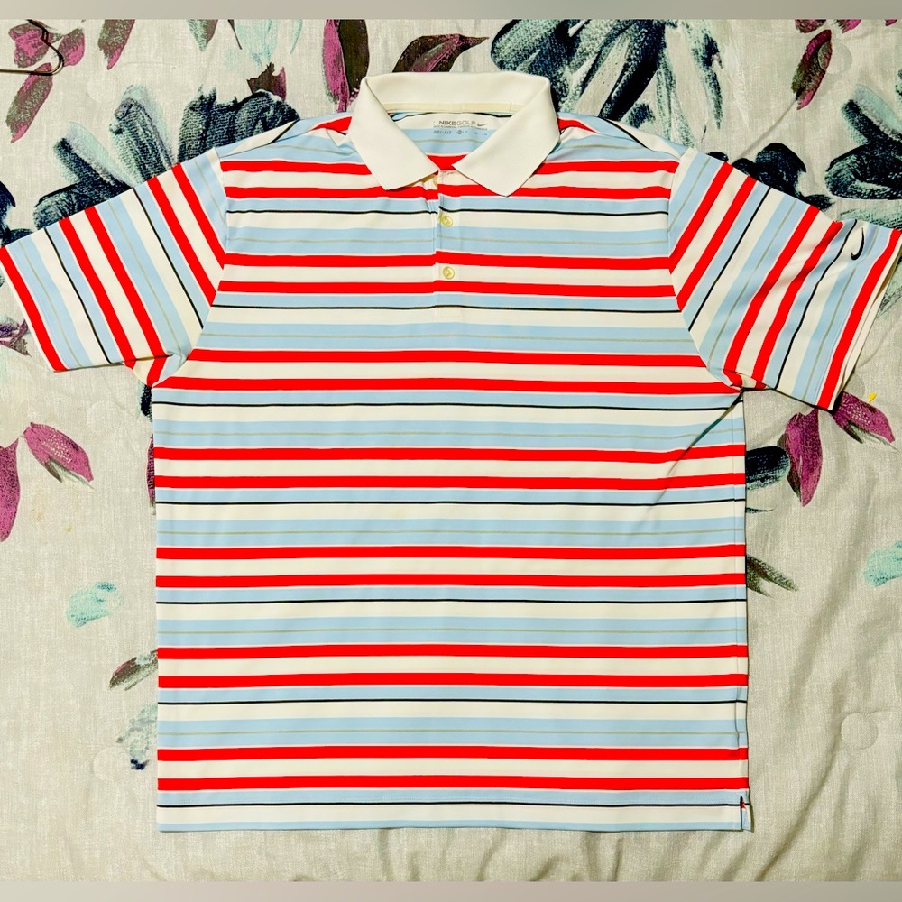Nike Dri-fit Polo. Striped Powder blue, red and white. Unworn,no tags. Size XL.